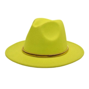 Detail of fluorescent yellow wool felt jazz hat with a gold metal decorative belt band