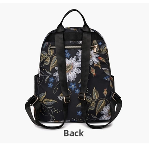 Detail view of the floral backpack back panel with adjustable straps and daisy print