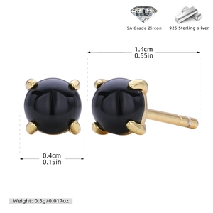 Detailed macro view of gold-plated S925 silver stud earring with black stone and cubic zirconia