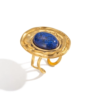 Detailed macro view of the lapis lazuli stone and hammered gold plated ring texture