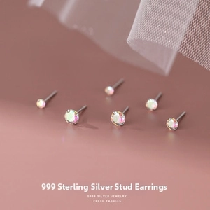 Macro shot of S999 silver screw back stud earrings with colorful cubic zirconia