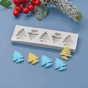 White silicone mold featuring five Christmas tree cavities for DIY cake baking and crafts
