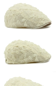 Detail view of cream floral lace beret featuring handmade 3D mesh roses and embroidery