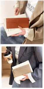 Detailed view of slim lychee grain leather card holder in orange and brown tones