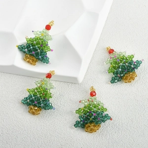 Detailed view of colorful beaded Christmas tree charms for DIY jewelry and hair accessories