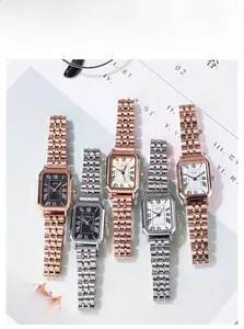 Close-up of elegant square GEDI watches with Roman numeral dials and metallic straps
