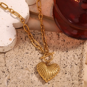 Detail of 18K gold-plated stainless steel OT toggle necklace with heart pendant