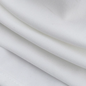 Macro view of white ribbed fabric texture and fine weave on the bikini top material