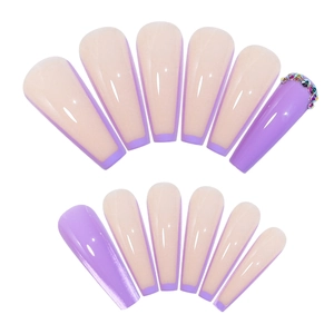 Long coffin press-on nails with purple French tips and colorful rhinestone accents