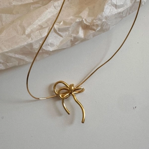 Elegant 925 sterling silver bow knot necklace in gold finish with a minimalist snake chain