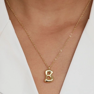 Polished 18k gold plated bubble letter B pendant necklace on a minimalist O-chain