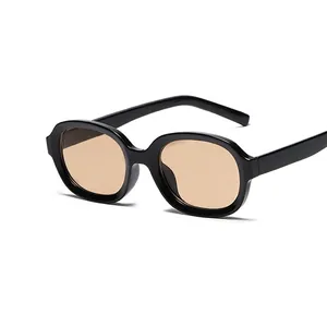 Vintage oval black glossy sunglasses with trendy brown translucent lenses for daily wear