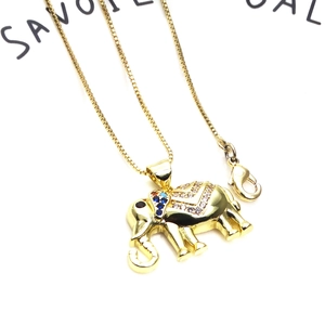 Detailed close-up of golden elephant pendant with colorful cubic zirconia and box chain