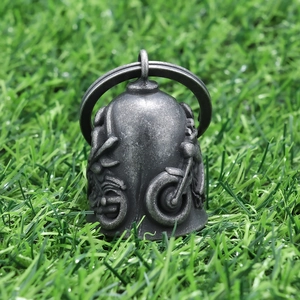 Detailed close-up of retro silver stainless steel biker bell with motorcycle embossing
