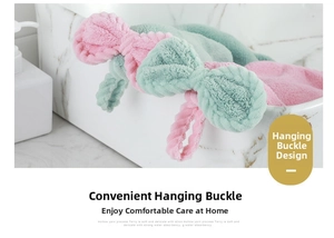 Detail showing the portable hanging loop on a coral fleece bow hand towel for quick drying