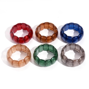 Set of six chunky acrylic bracelets with glitter details and elastic geometric beads