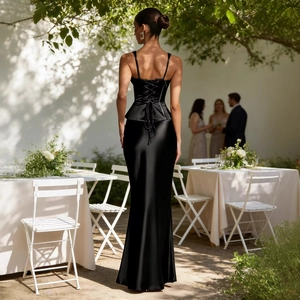 Elegant black satin two-piece evening set featuring a tie-up waist top and slim maxi skirt