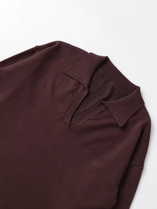 Detail of coffee brown knit polo collar with V-neckline and fine ribbed texture