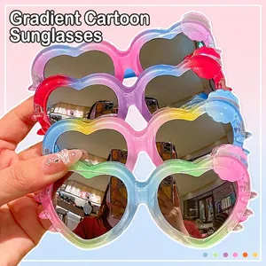 Kids heart-shaped gradient sunglasses with decorative wavy frames and reflective lenses