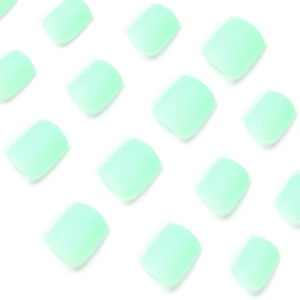 Short square matte mint green gradient press-on nail tips set on white background