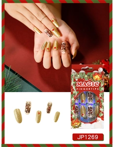 Detailed view of Christmas press on nails with reindeer art and Magic Fingertips packaging