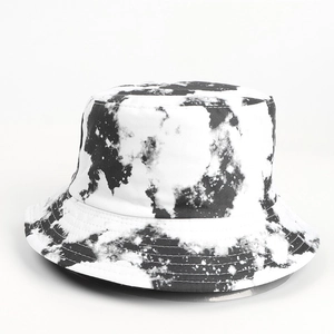 Close-up of black and white tie-dye bucket hat with detailed stitching and canvas texture