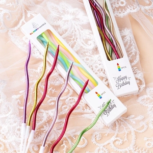 Set of 6 colorful wavy spiral birthday candles in a white window gift box packaging