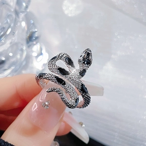 Detailed close-up of snake ring showing intricate scales and black enamel accents