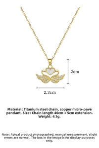 Detailed view of gold swan heart pendant with dimensions 2.3x2cm and 40cm titanium chain