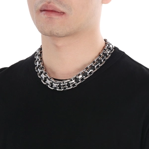 Close-up of retro 20mm chunky hollow saddle chain necklace in vintage silver steel on model