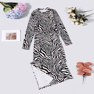 Detail of zebra print dress fabric showing milk silk texture and side slit design