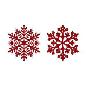 Dettaglio di due fiocchi di neve rossi glitterati per decorazioni di Natale e addobbi