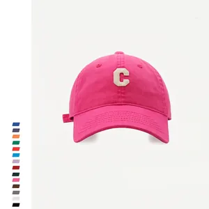 Detailed view of rose pink cotton baseball cap with vintage C letter towel embroidery