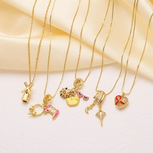 Five styles of 18k gold plated necklaces featuring gaming headsets and heart pendants