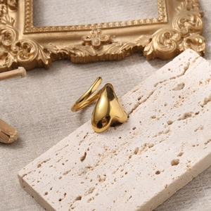 18k gold plated stainless steel heart wrap open ring on a natural stone base