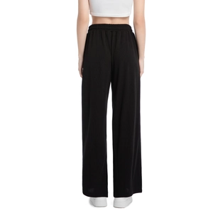 Rear view of black high-waisted wide-leg knit pants with vertical ribbed texture