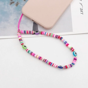 Colorful devil eye glass beaded phone strap in candy colors on pink mobile case