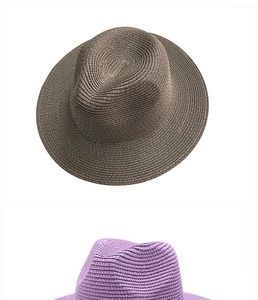 Dettaglio della trama in paglia di carta su cappelli Panama marroni e viola