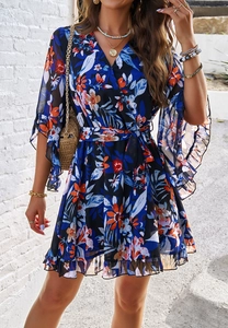Detail of V-neck floral chiffon dress with ruffled sleeves and adjustable waist tie