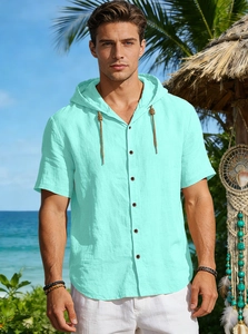 Detail view of mint green hooded linen shirt with drawstring for beach leisure