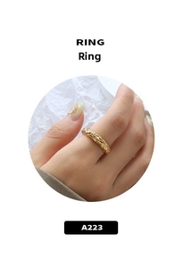Close-up of double-layer ring with vintage hammered foil texture in 18k gold finish