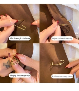 Detail of hand adjusting golden bear safety pin brooch on a brown blazer lapel