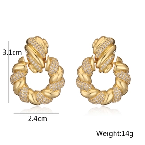 Detail view of 18K gold-plated twisted hoop earrings with cubic zirconia, 3.1cm height