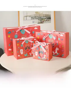 Pink 'it's a girl' baby shower gift bags set with silk bows in four various sizes