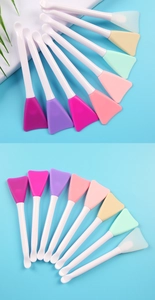 Detailed close-up of double-ended silicone face mask brushes in various vibrant colors