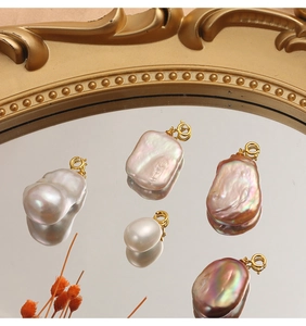 Macro detail of natural baroque pearl pendants with gold plated S925 sterling silver clasps
