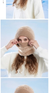 Detail of beige knit balaclava hood with plush faux fur lining for winter warmth