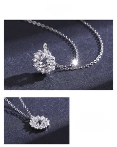 Detail of S925 sterling silver flower necklace with marquise and round zircon stones