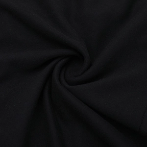 Close-up of soft black knit fabric texture showing fine weave and elegant drape detail
