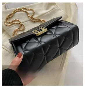 Detail shot of the reinforced bottom and diamond quilted leather on black chain bag